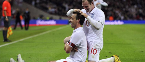 Wayne Rooney congratulates John Terry on his winner against Ukraine.